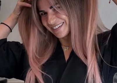 A woman holding her hair.